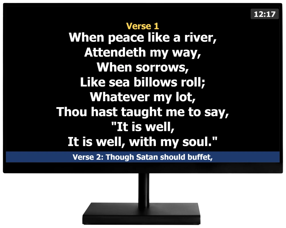 Stage display on a monitor showing Verse 1 of It Is Well With My Soul, a clock and the next verse